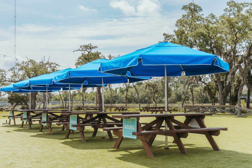 Blue Umbrellas set in a row at a local Charleston event space