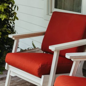 Terracotta Sunbrella Marine-Grade canvas cushions on a Bourbon Chair. 