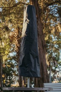 Black Palmetto Canopy Storage Cover on a Palmetto Umbrella.