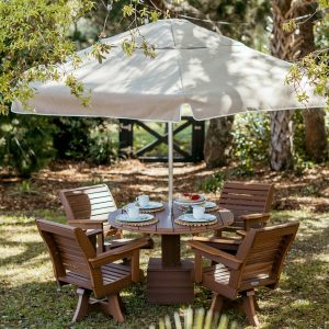 Palmetto Ebb Tide Patio Package with antique mahogany poly table, four Low Tide chairs, and a Sunbrella® Tresco Linen canopy.