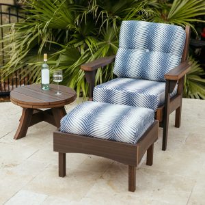 Sweetgrass Chair in Brazilian Walnut, featuring Clock Out Indigo Sunbrella® cushions.