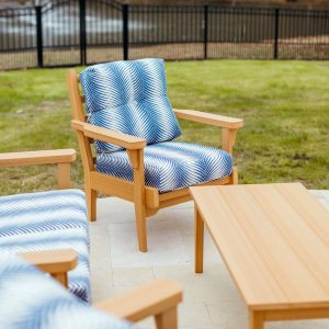 Sweetgrass Chair in Natural Teak, featuring Clock Out Indigo Sunbrella® cushions.