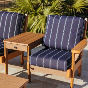 Sweetgrass Duo with center table in antique mahogany, featuring Cooper Navy Sunbrella® cushions