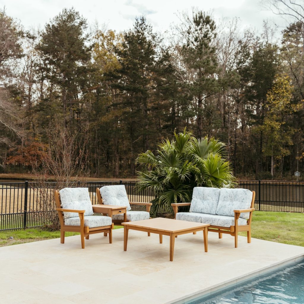 The Sweetgrass Gather Package in Antique Mahogany and Calm Laurel Cushions featuring the Sweetgrass Duo with center table, Sweetgrass loveseat, and Sweetgrass coffee table.