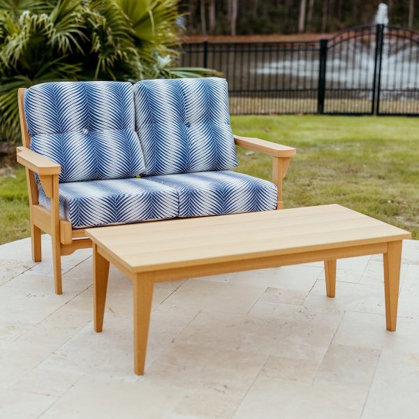 Sweetgrass Loveseat in Natural Teak, featuring Clock Out Indigo Sunbrella® cushions