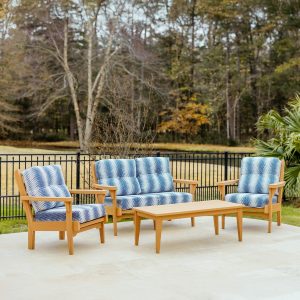Sweetgrass Signature Package in Natural Teak with Sunbrella Clock Out Indigo Cushions. Package includes the Sweetgrass Loveseat, two Sweetgrass Chairs and a Sweetgrass Coffee Table.