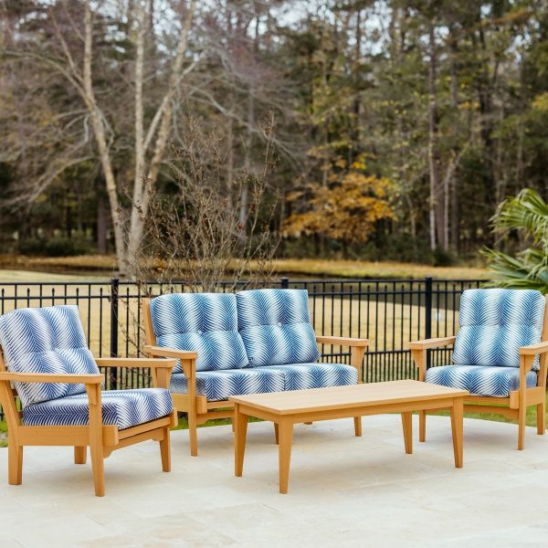 Sweetgrass Signature Package in Natural Teak and Clock Out Indigo Cushions featuring a Sweetgrass loveseat, two Sweetgrass chairs, and a coordinating Sweetgrass coffee table.
